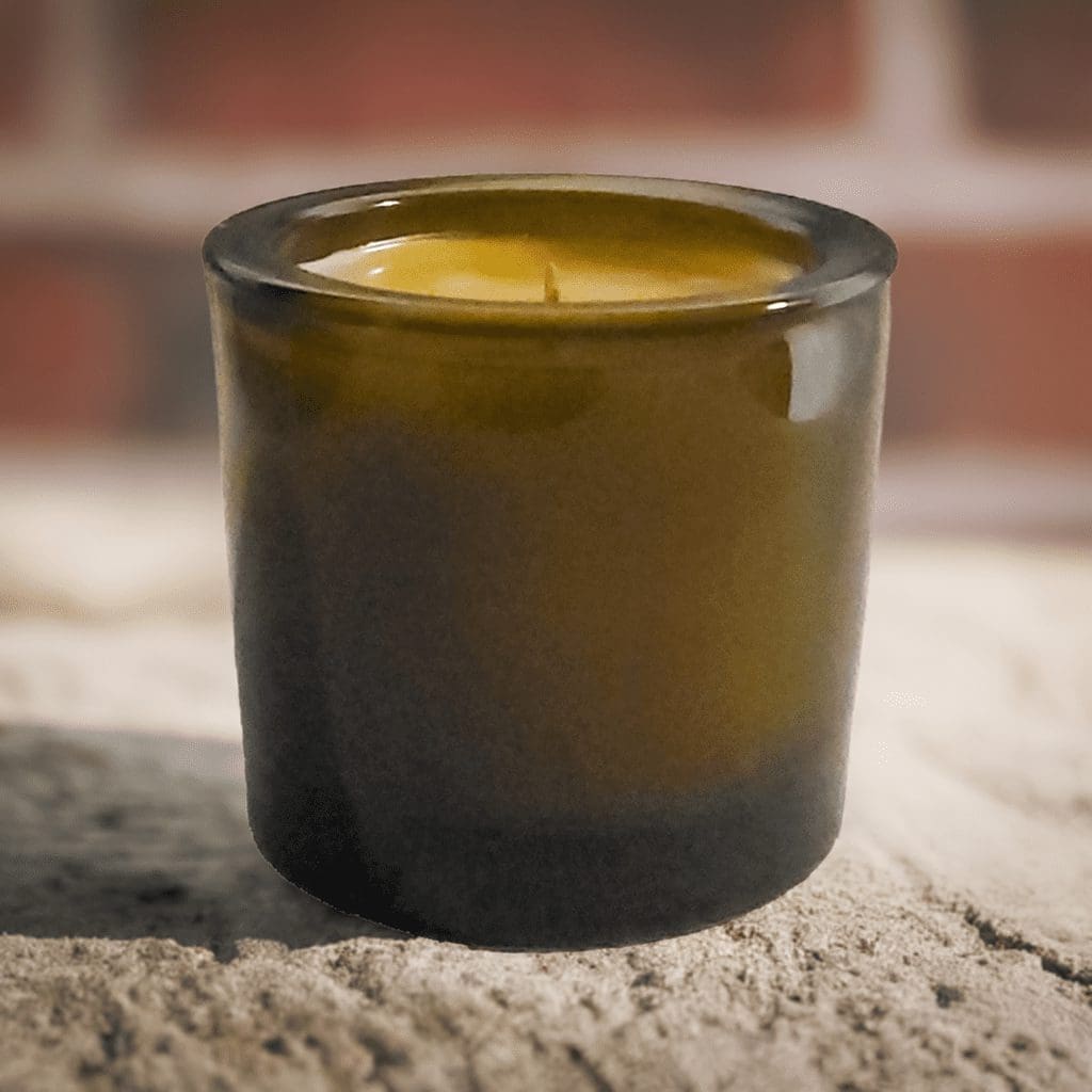 single small glass container beeswax candle