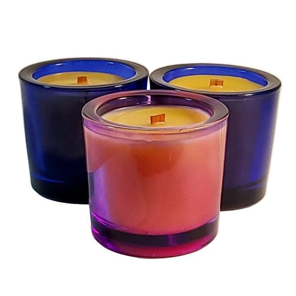 Group of three small round glass container beeswax candles