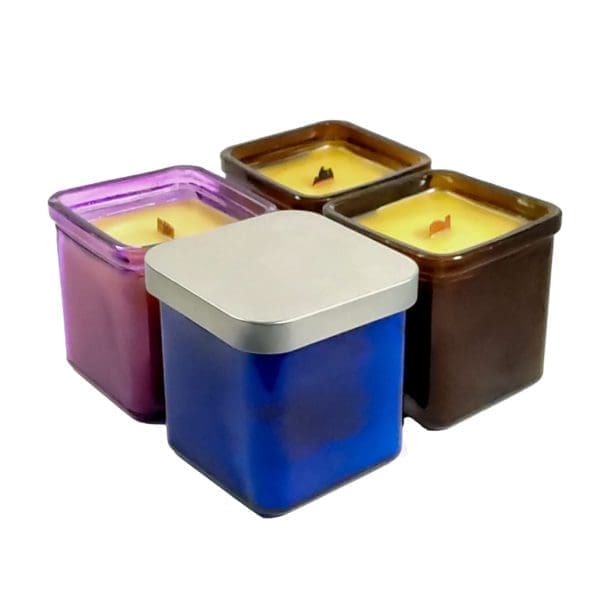 group of four glass square container besswax candles